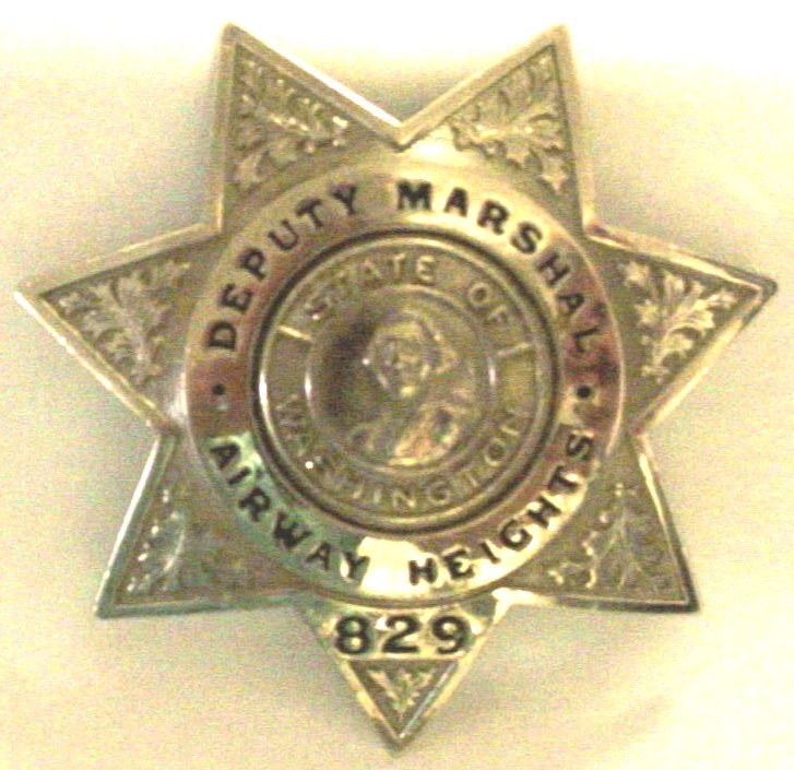 A Deputy Marshal star-shaped badge.